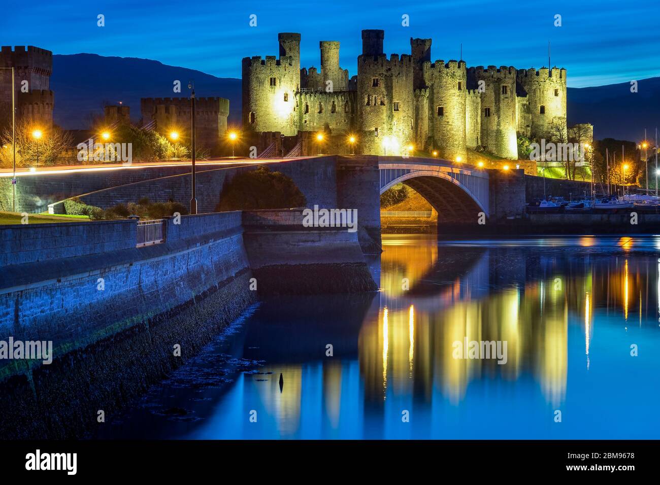 Conwy Castle illuminated above the River Conwy at Night, Conwy, North Wales, UK Stock Photo