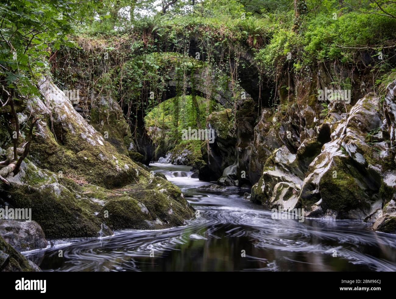 Roman Bridge over the River Machno, near Penmachno, Conwy County, Snowdonia National Park, North Wales, UK Stock Photo