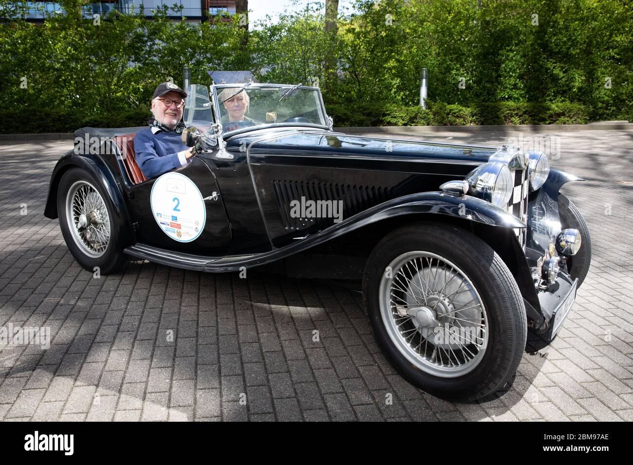 Hamburg Germany 06th May 2020 Claus Mirbach And His Wife Britta Are Sitting In Their Classic Car Mg Model Tc Built In 1947 On A Parking Lot In Front Of Their