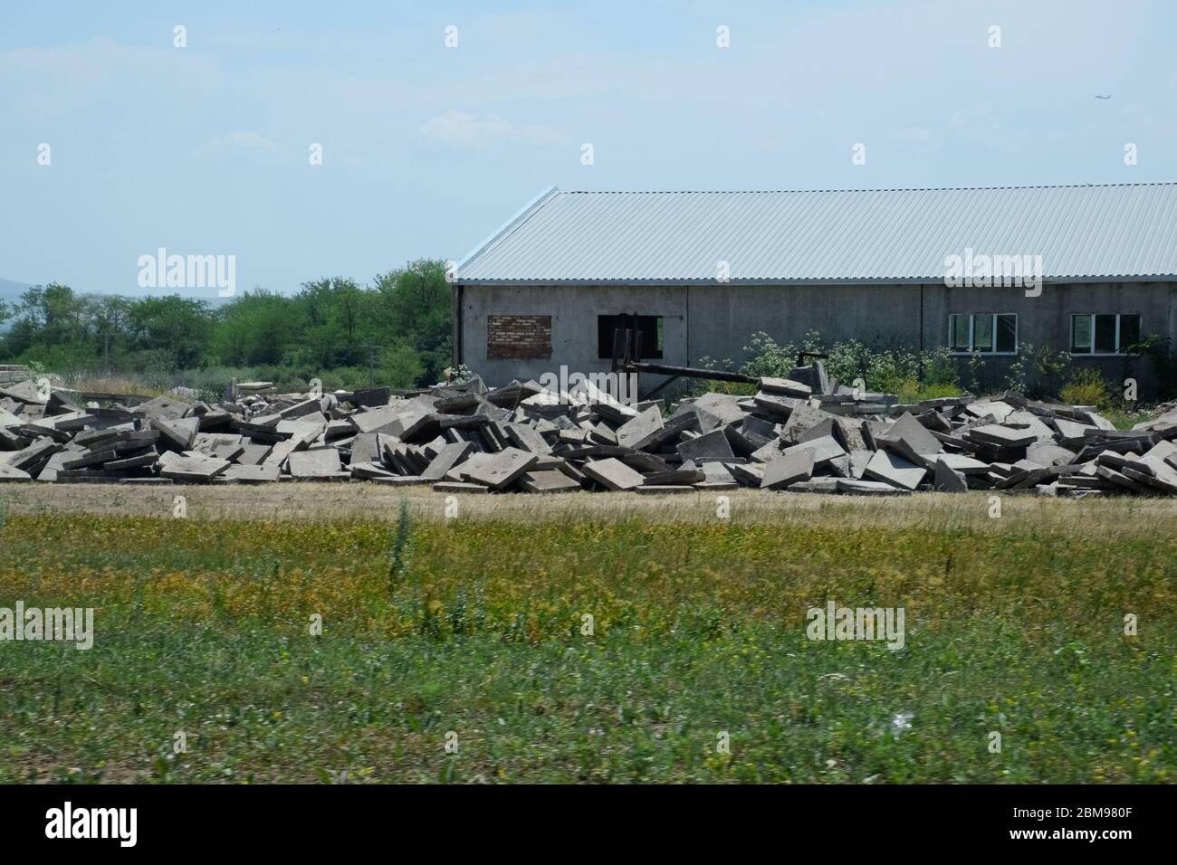 pile of concrete slabs piled up near the old building Stock Photo - Alamy
