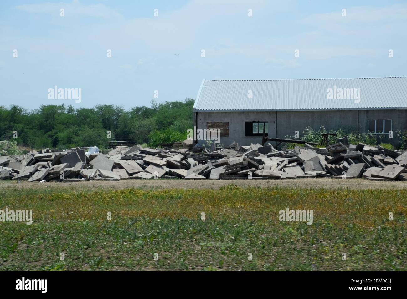 pile of concrete slabs piled up near the old building Stock Photo - Alamy