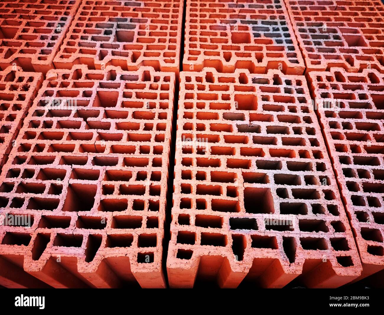 Red new bricks with holes background and texture Stock Photo