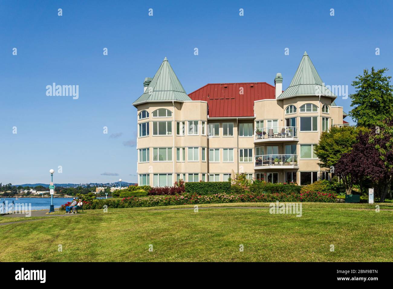 VICTORIA, CANADA - JULY 14, 2019: Modern apartment building facade view with big green lawn. Stock Photo