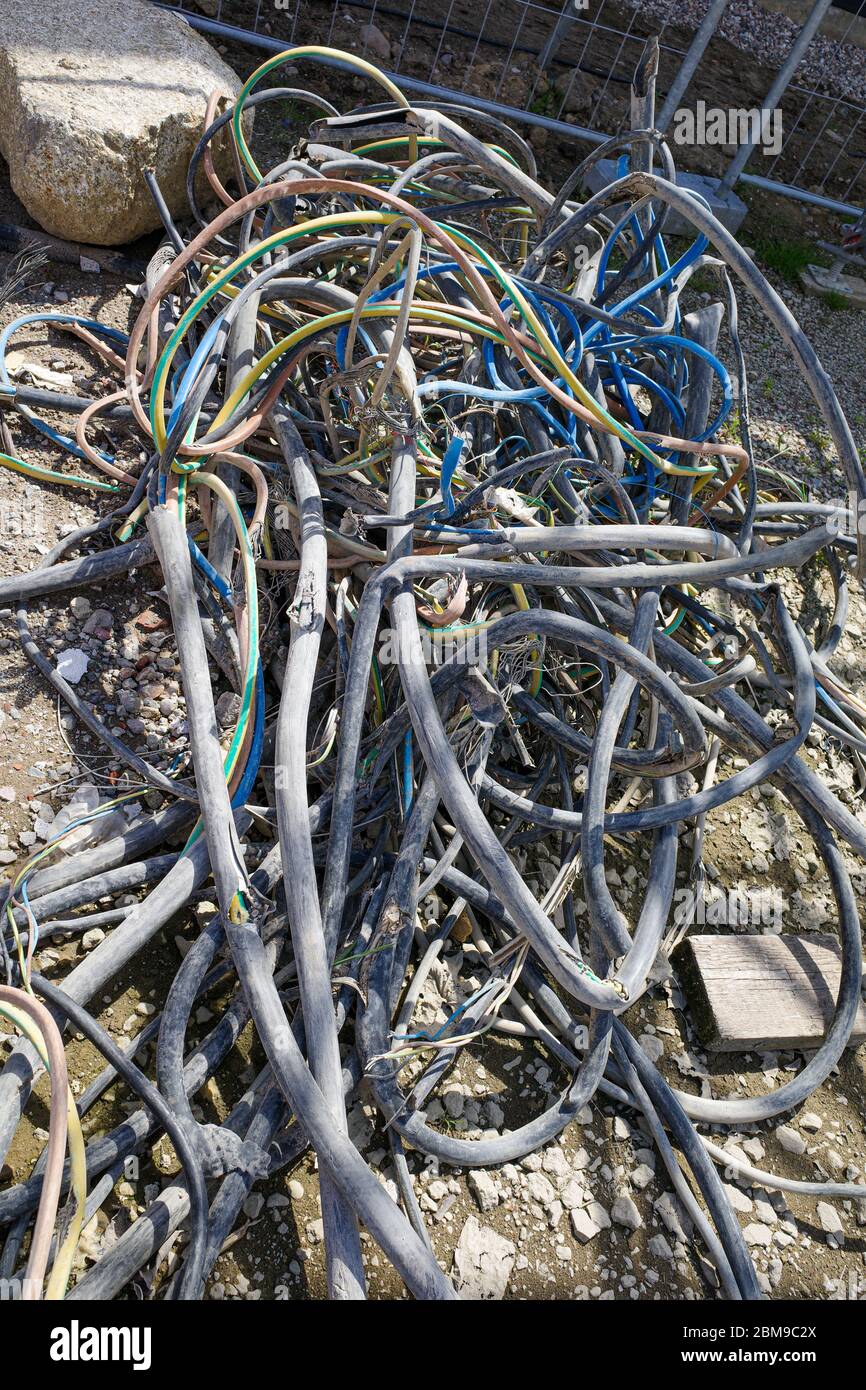 on a construction site a pile of old electric cables Stock Photo Alamy
