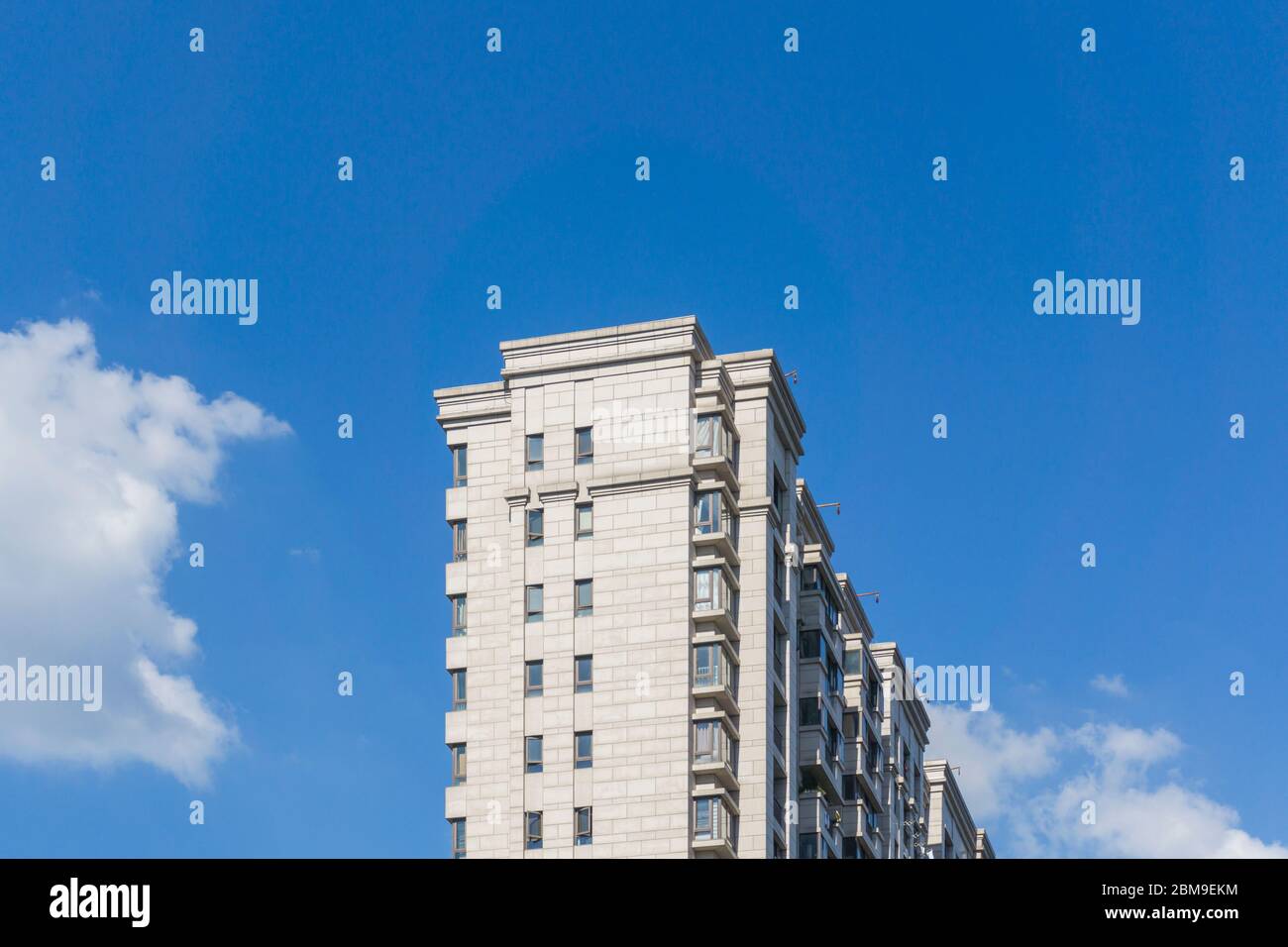Residential area under blue sky and white clouds Stock Photo - Alamy