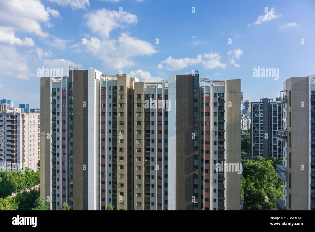 Residential area under blue sky and white clouds Stock Photo - Alamy