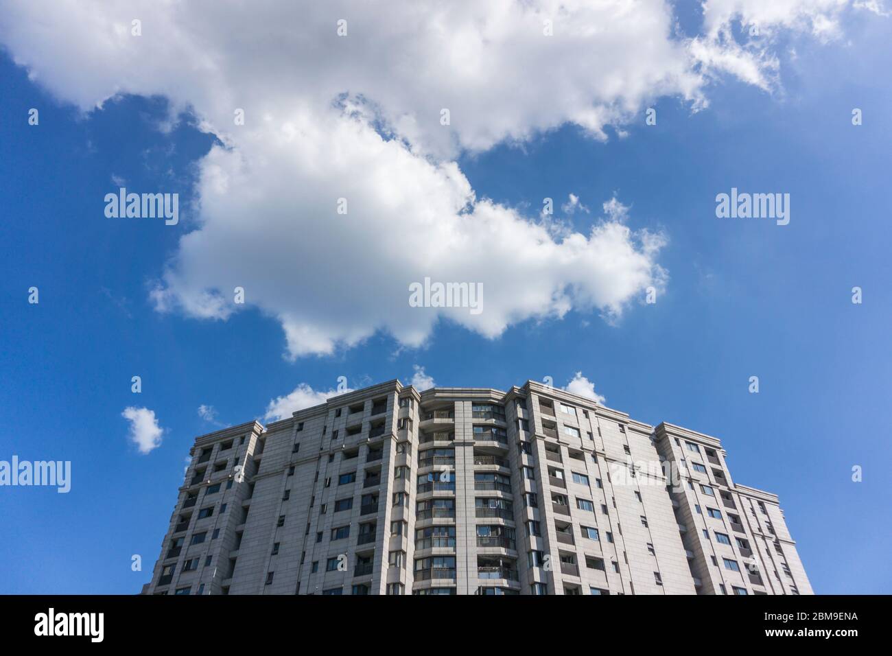Residential area under blue sky and white clouds Stock Photo - Alamy