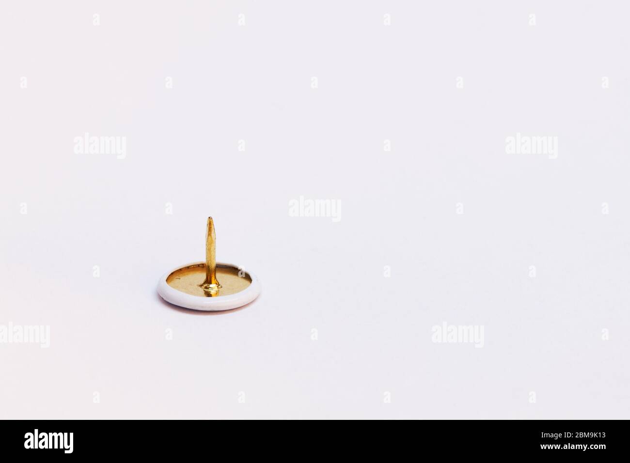a sharp thumbtack on white background Stock Photo Alamy