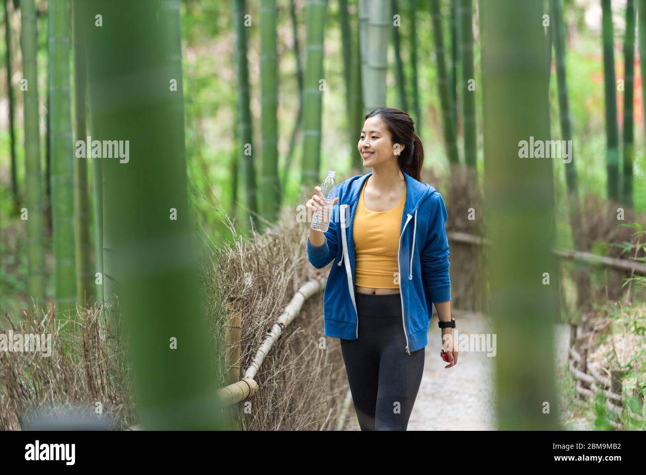Young chinese woman walks hi-res stock photography and images - Alamy