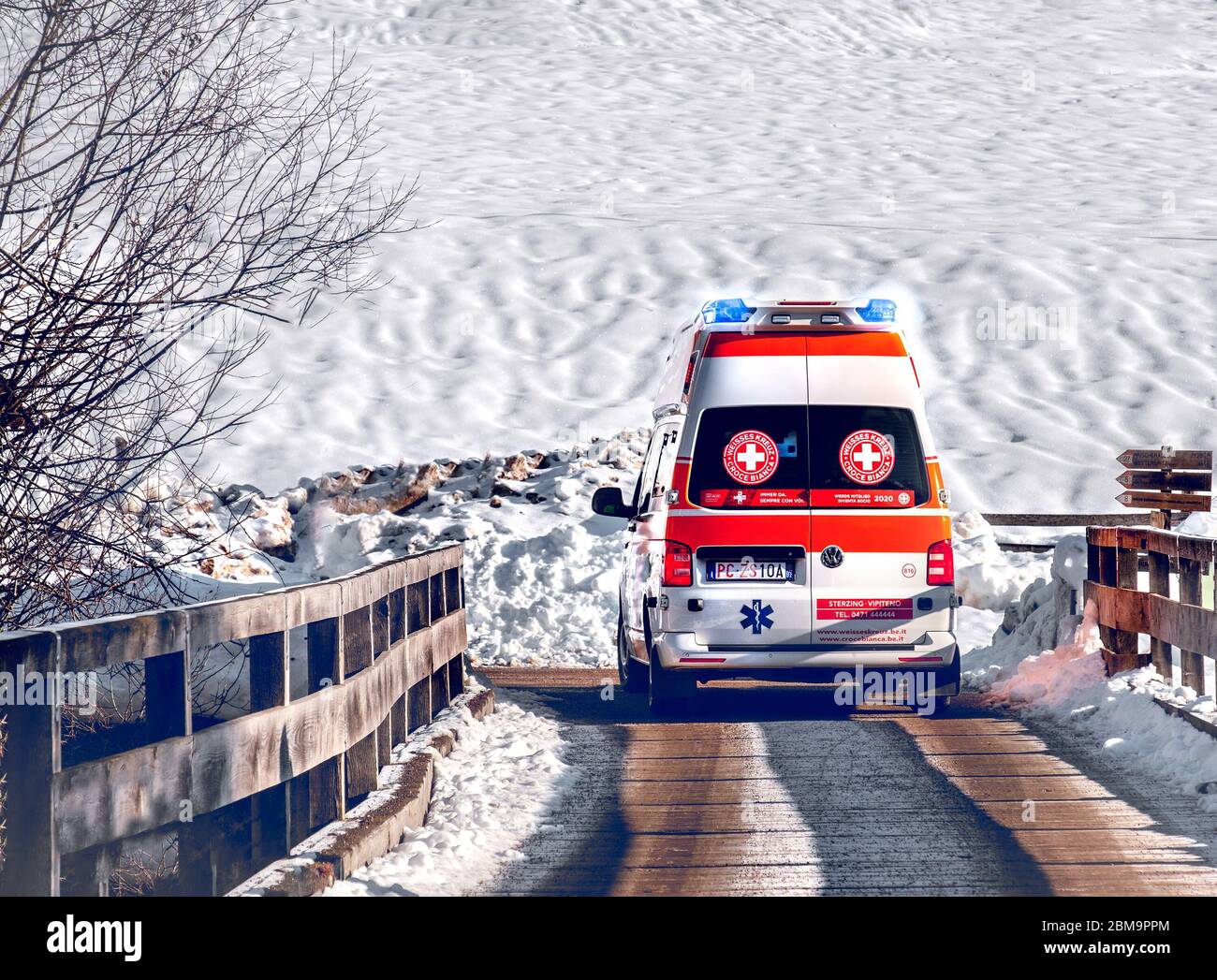 snow emergency ambulance with in winter snow background road Stock Photo