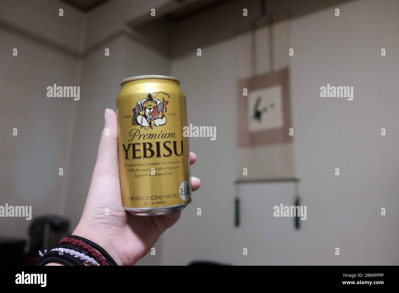 Yebisu Beer in Hand in Room, Japan Stock Photo