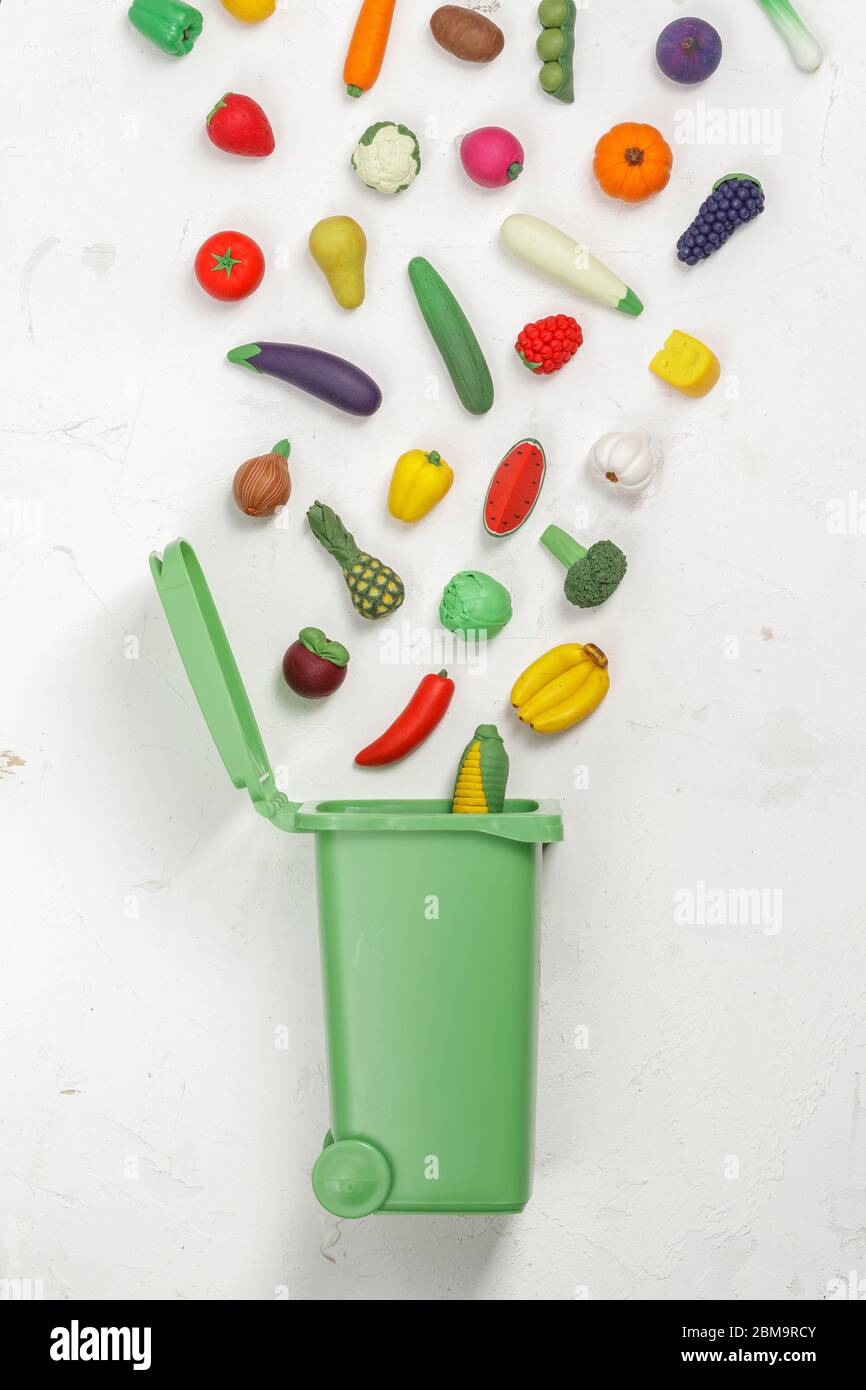 Food Waste Prevention Concept. Fruits and Vegetables falling into the