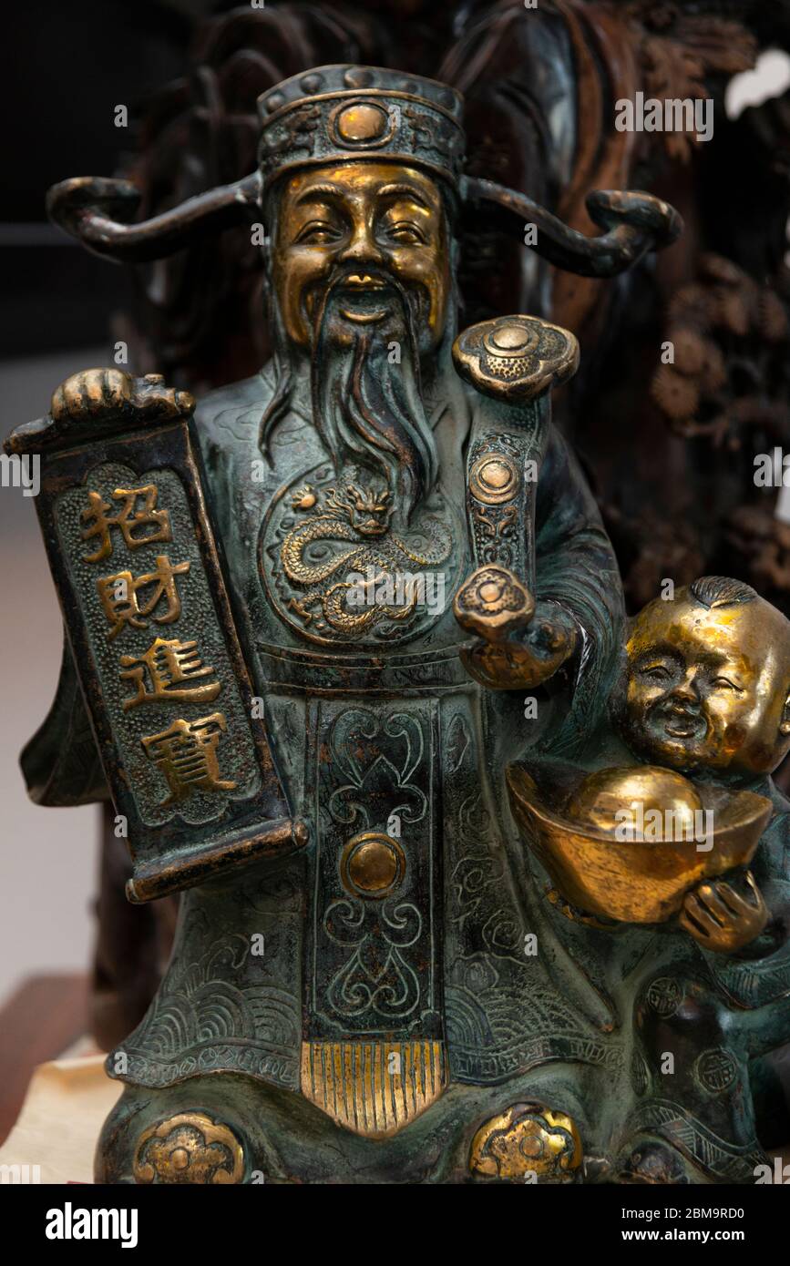 Chinese traditional bronze statue of the God of wealth Stock Photo