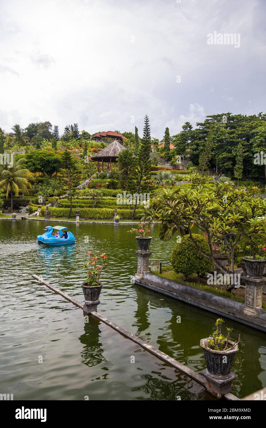 BALI, INDONESIA - JANUARY 27, 2019: Unidentified poeple at Tirta Gangga water palace at Bali, Indonesia. It is a former royal palace in eastern Bali, Stock Photo