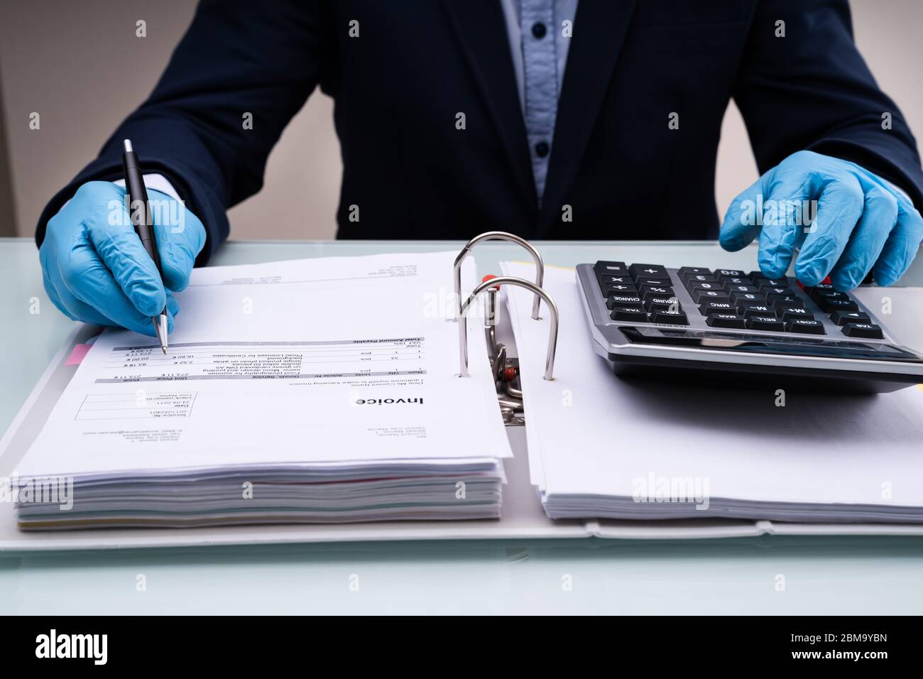Calculate Tax And Corporate Finance Budget In Gloves Stock Photo - Alamy