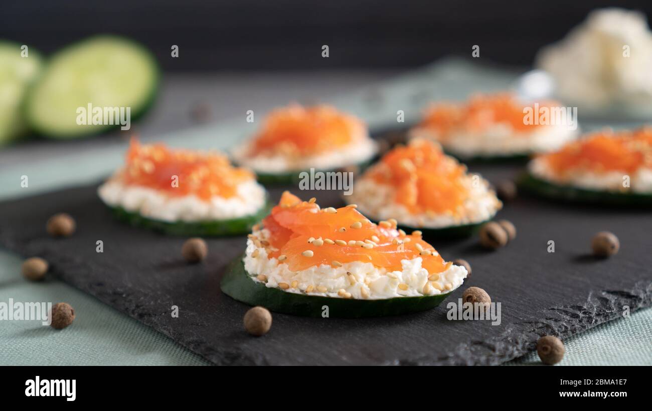 Healthy alternative to a standard sandwich. Cucumber, cream cheese and salmon Stock Photo