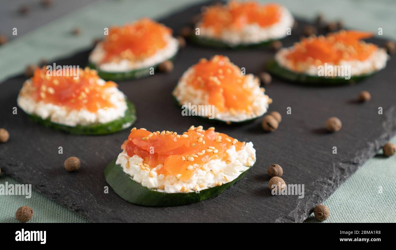 Healthy alternative to a standard sandwich. Cucumber, cream cheese and salmon Stock Photo