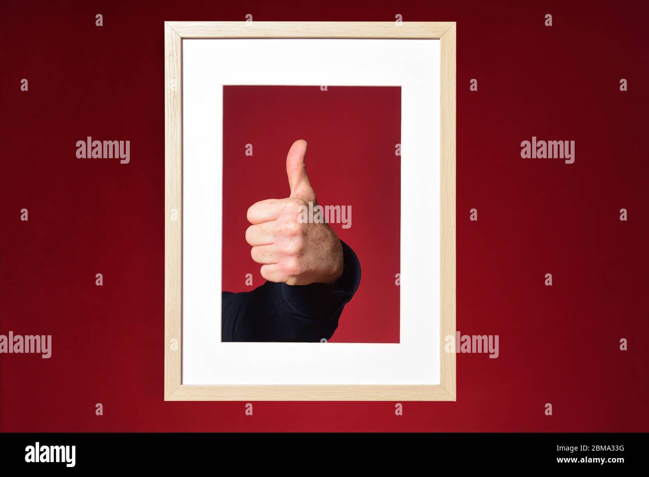 hand with ok sign on red background Stock Photo - Alamy