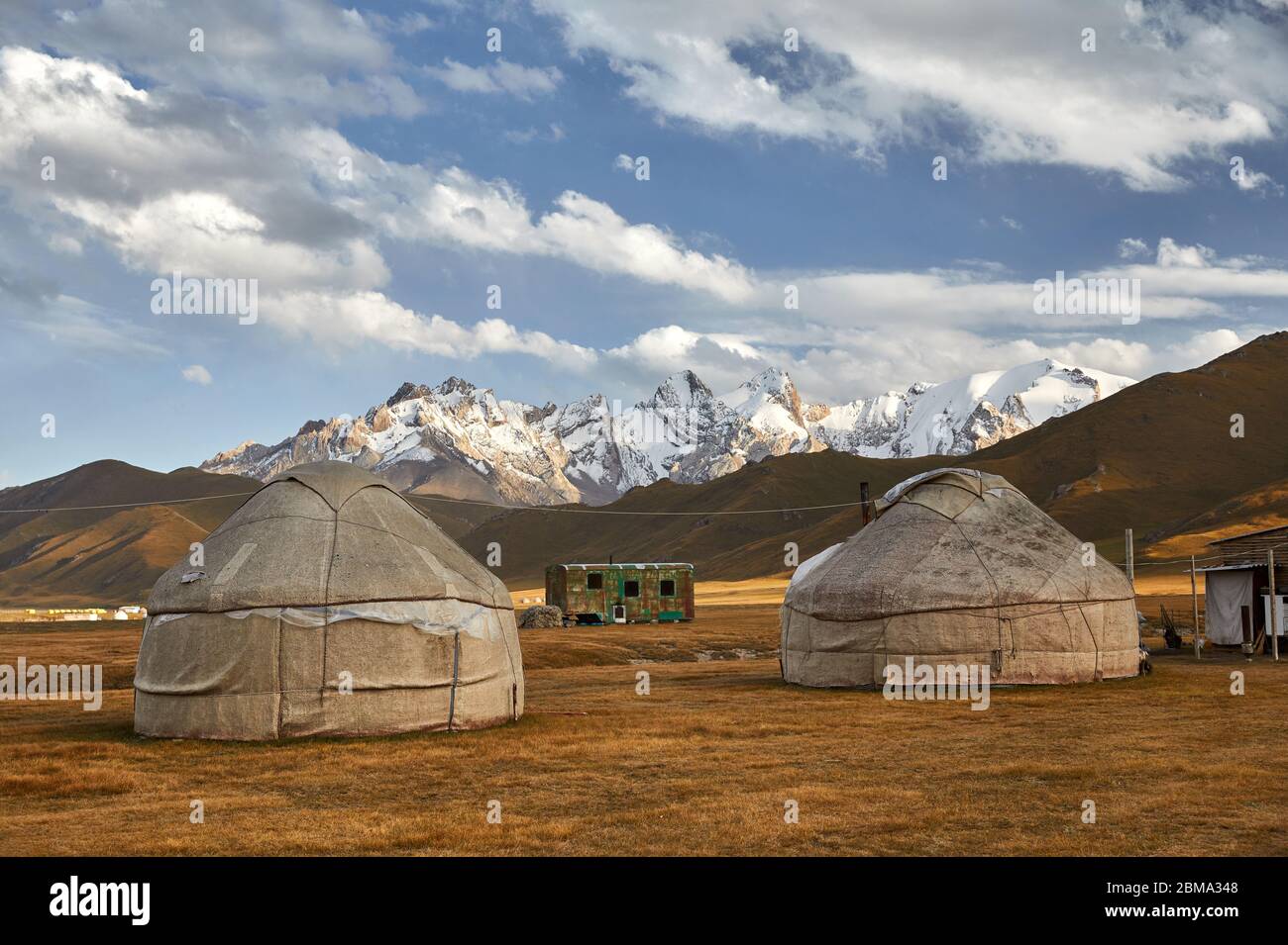 Yurt nomadic houses camp at mountain valley in Central Asia Stock Photo