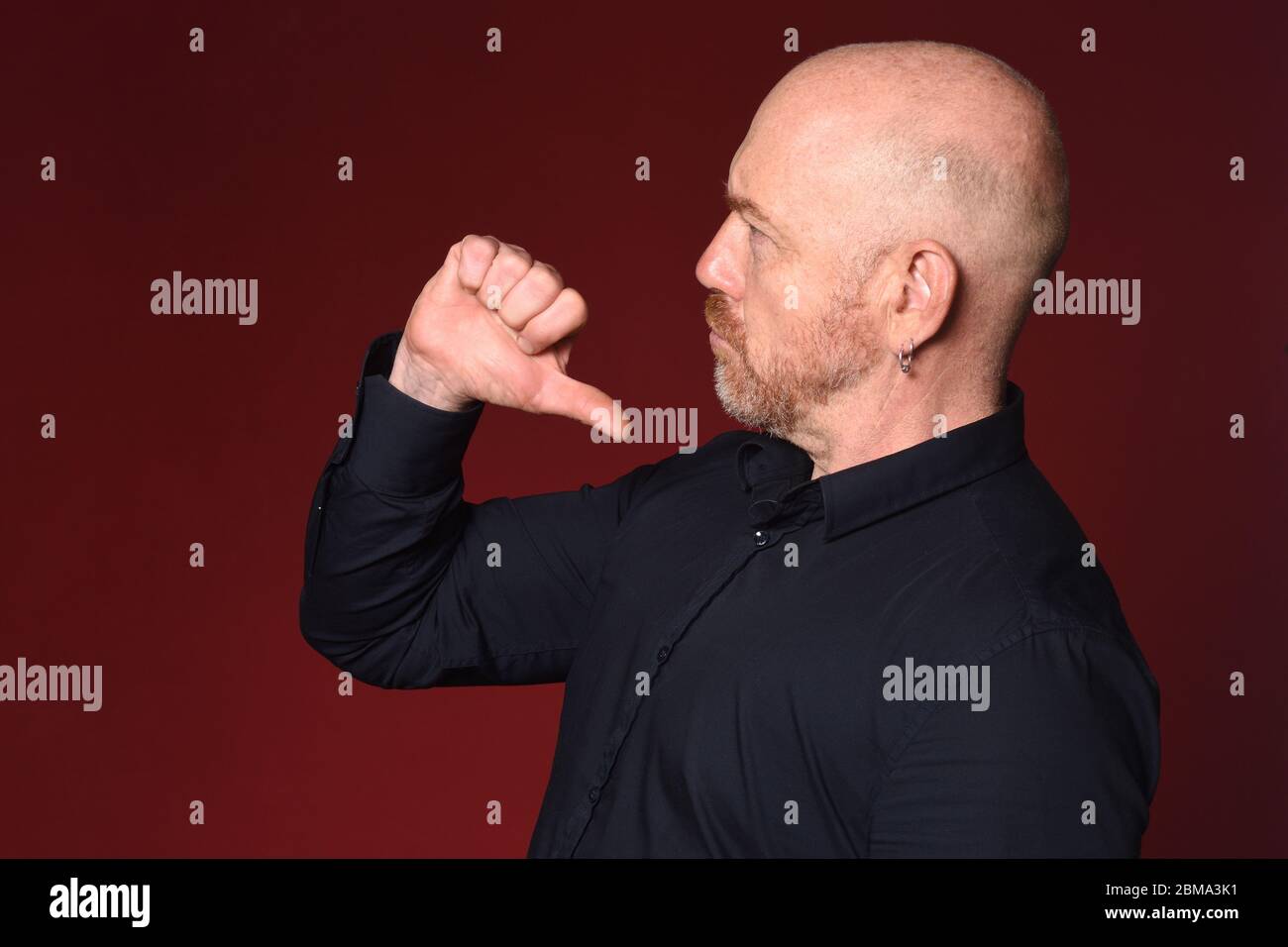 man pointing himself on red background Stock Photo