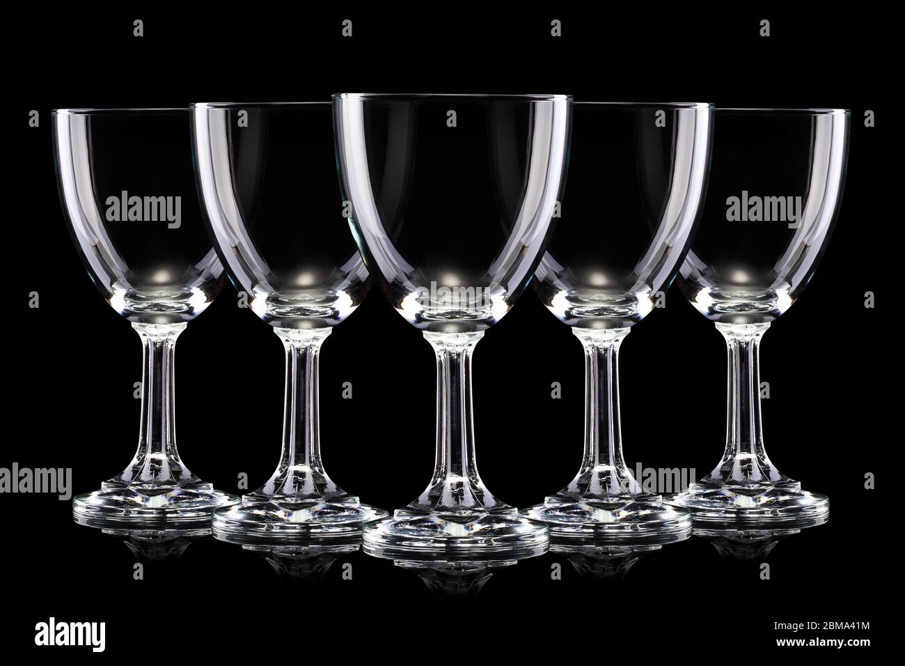 https://c8.alamy.com/comp/2BMA41M/set-of-empty-glasses-of-light-beer-with-foam-isolated-on-a-black-background-2BMA41M.jpg