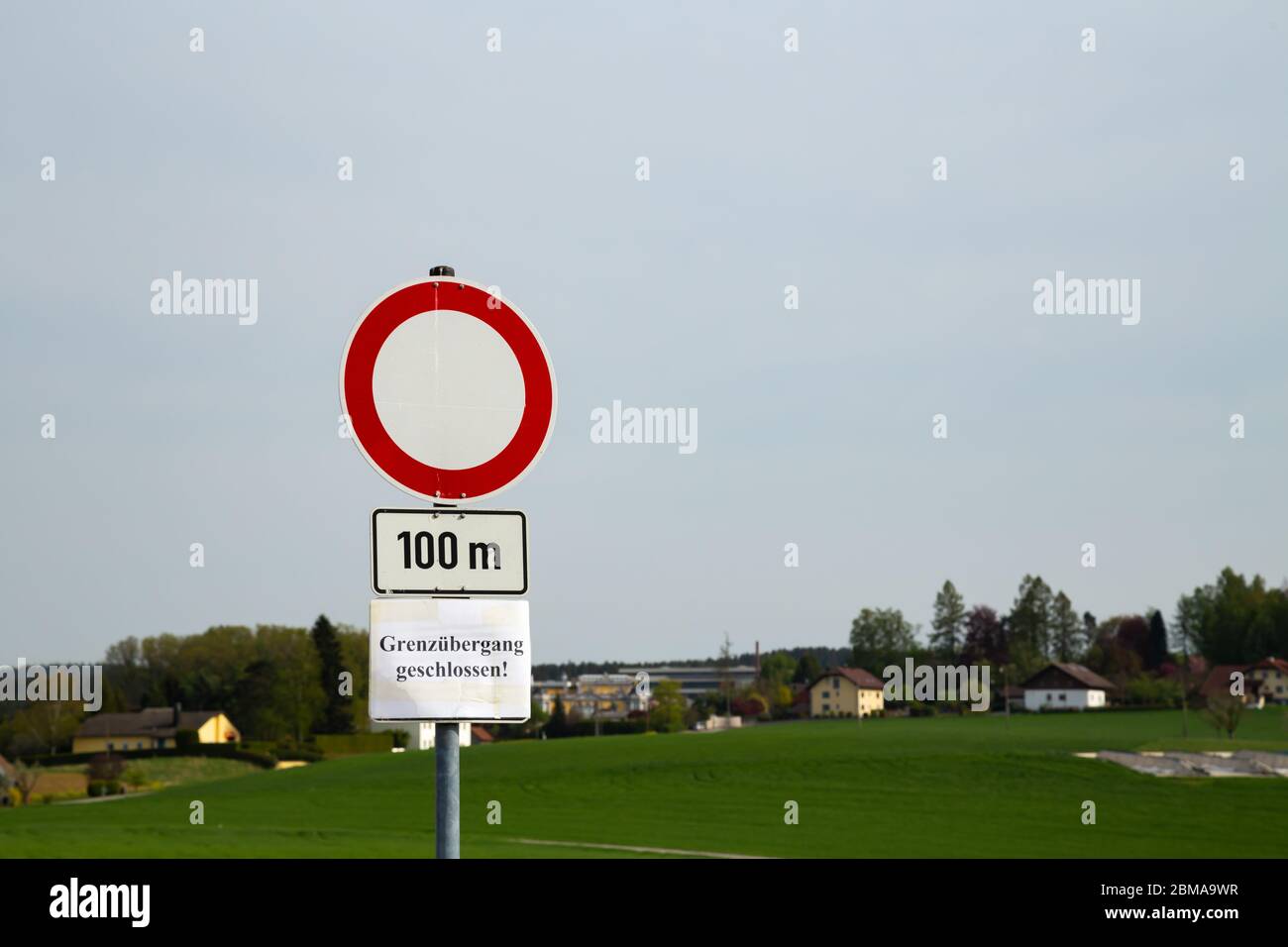 Road sign showing 'Border checkpoint closed' between Germany and Austria showing because of Covid-19 Stock Photo