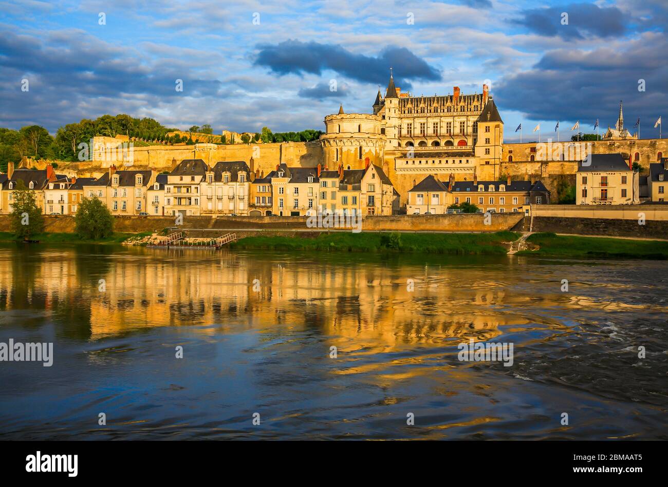 View of the Royal Chateau and river at sunset, Amboise, Main-et-Loire, Loire Valley, France, Europe Stock Photo