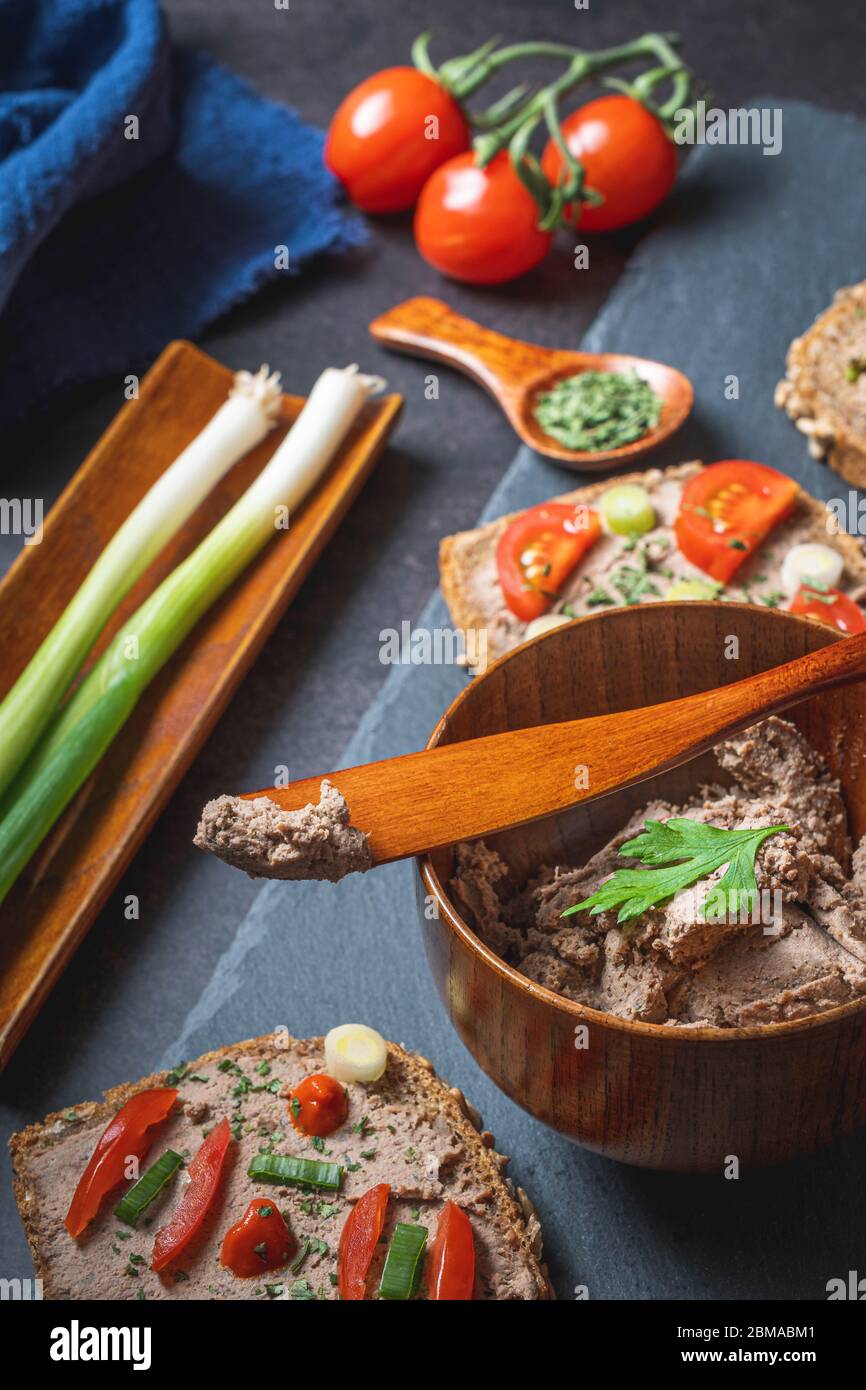 Rustic Pate Homemade Rustic Pate on Bitten Slice of Bread with Fresh Vegetables ...