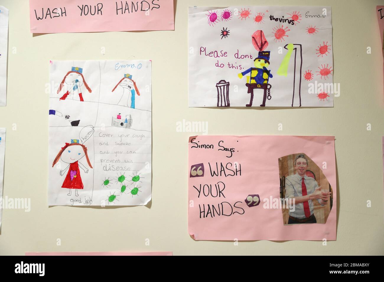 Artwork by children of members of An Garda hang on the wall of Finglas Garda station in Dublin. Members of An Garda continue to engage in a wide range of community activites, in an effort to help people through the Covid-19 pandemic, including delivering medicine for people self-isolating, collecting pensions, and doing the shopping for people cocooning. Stock Photo