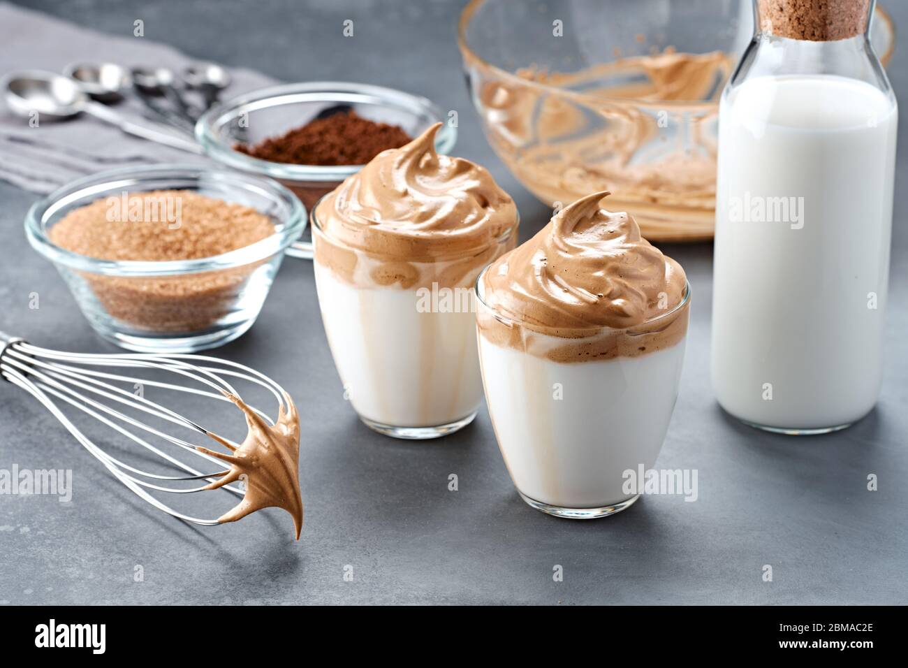 Dalgona coffee. Trendy Korean whipped drink. Fluffy drink made by whipping in equal proportions