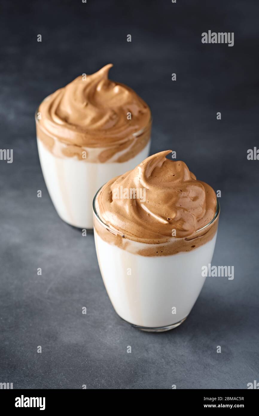 Dalgona coffee. Trendy Korean whipped drink. Fluffy drink made by whipping in equal proportions