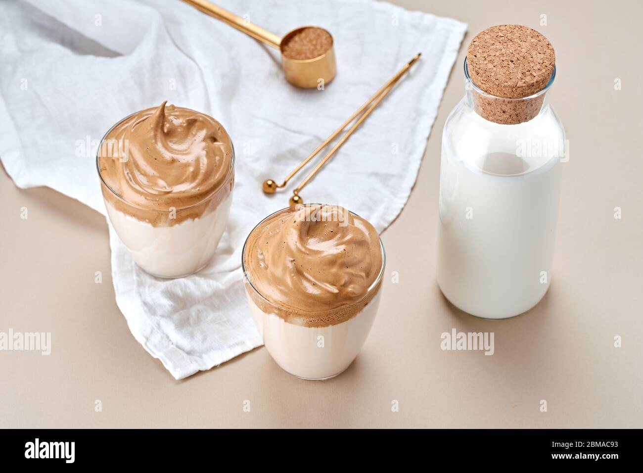 Dalgona coffee. Trendy Korean whipped drink. Fluffy drink made by whipping in equal proportions