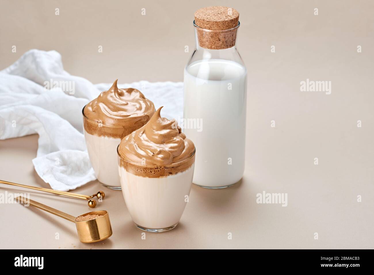 Dalgona coffee. Trendy Korean whipped drink. Fluffy drink made by whipping in equal proportions