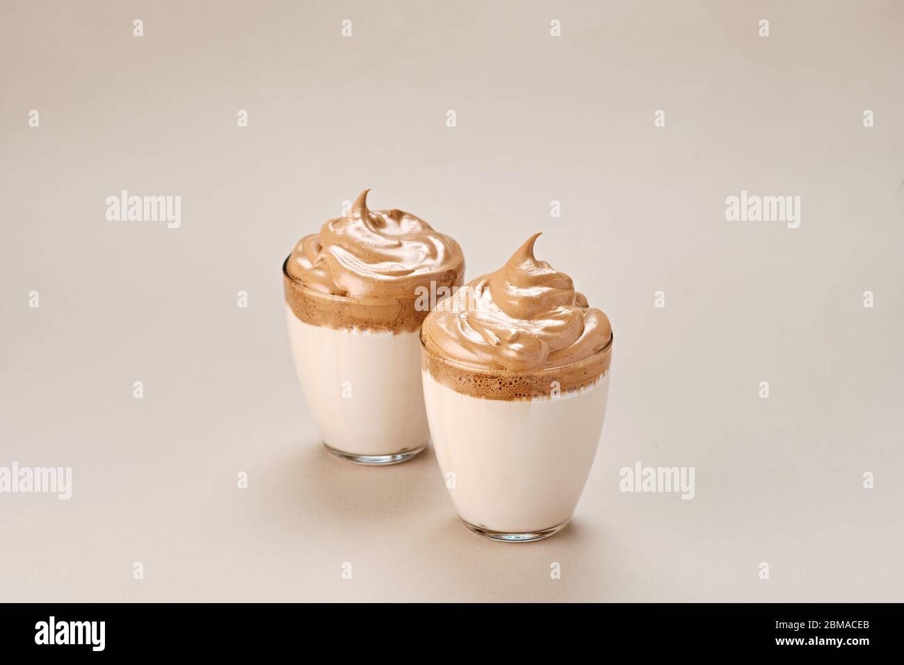 Dalgona coffee. Trendy Korean whipped drink. Fluffy drink made by whipping in equal proportions