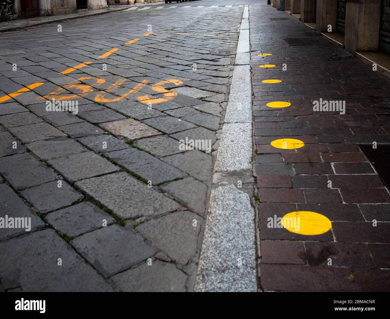 Cremona, Lombardy, Italy May 5 6 7 2020 road marking on sidewalk in
