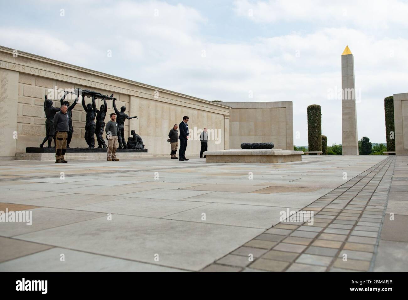 Staff at the deserted National Memorial Arboretum in Alrewas, Staffordshire, observe a two minutes' silence to commemorate the 75th anniversary of VE Day. Mark Ellis, head of visitor experience, laid a wreath. Normally the Arboretum would welcome around 10,000 visitors to mark such an occasion. Stock Photo