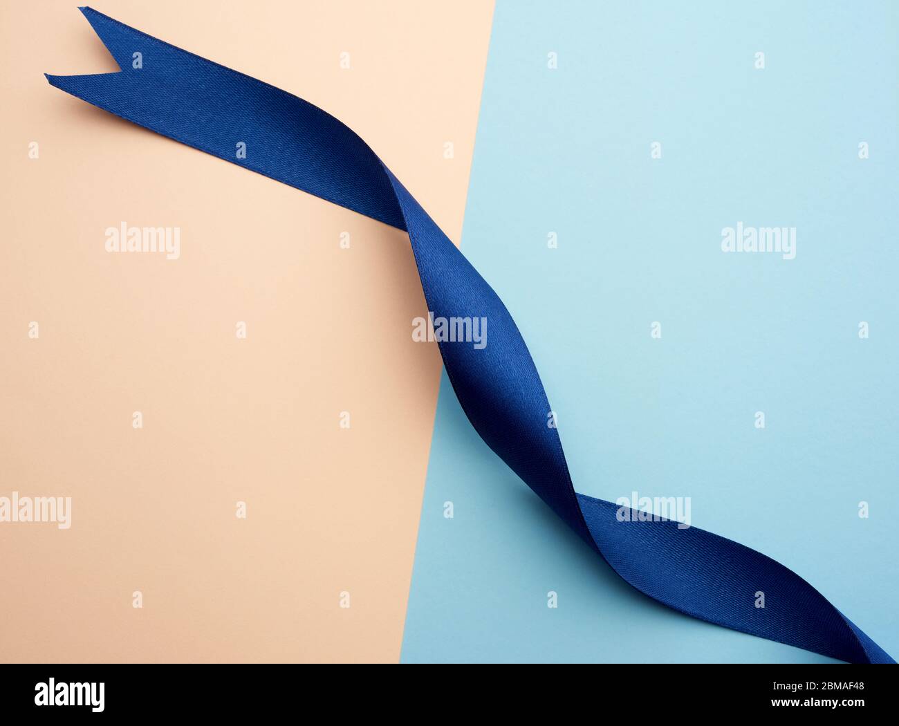 Twisted Ribbons Blue Twisted blue satin ribbon hi-res stock photography and images - Alamy