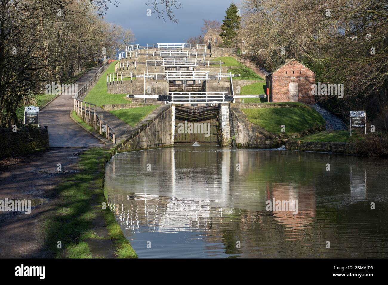 Five Rise locks on the Leeds and Liverpool Canal near Bingley, West Yorkshire Stock Photo