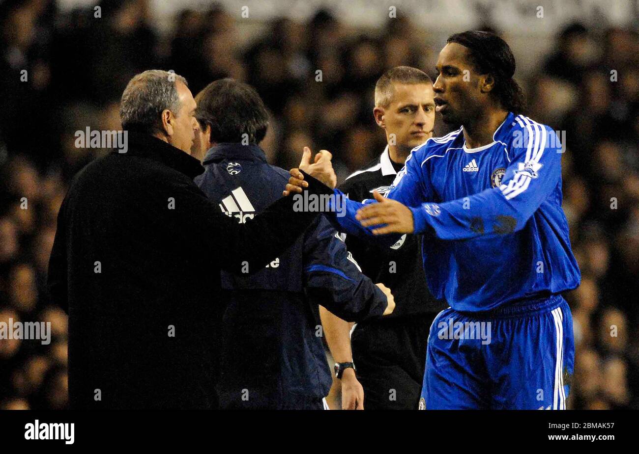 LONDON, UK march 19: Didier Drogba (Chelsea, right) clasps hands with Avram Grant (Chelsea manager) to celebrate his first goal during Barclays Premie Stock Photo