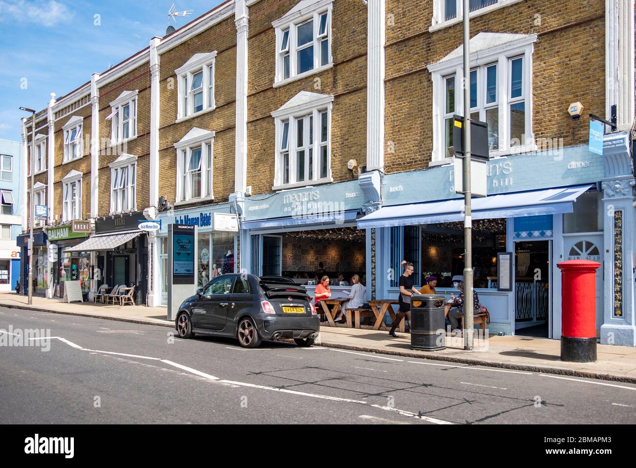 LONDON- High street shopping scene in Balham, an area of south west London Stock Photo