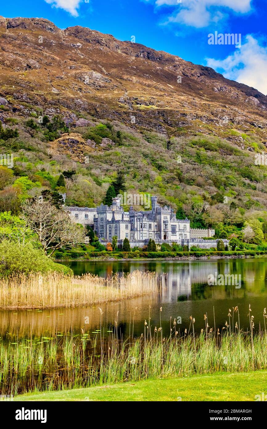 Kylemore Abbey with Doughruagh summit behind, County Galway, Ireland Stock Photo