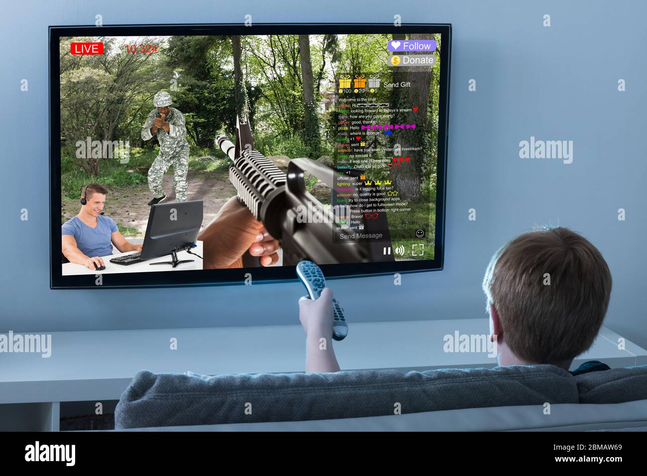 Kid Watching Live Game Streaming Session On TV Screen Stock Photo