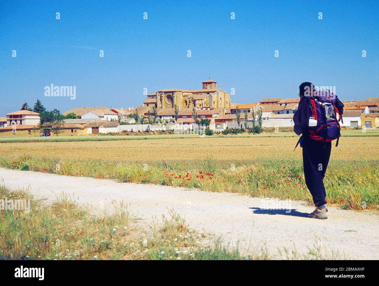 Pilgrim walking along Camino de Santiago. Villalcazar de Sirga, Palencia province, Castilla Leon, Spain. Stock Photo