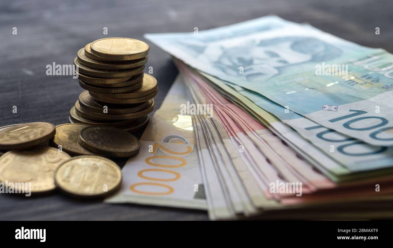 Serbian money dinar, pile of coins on wooden table, close up Stock Photo