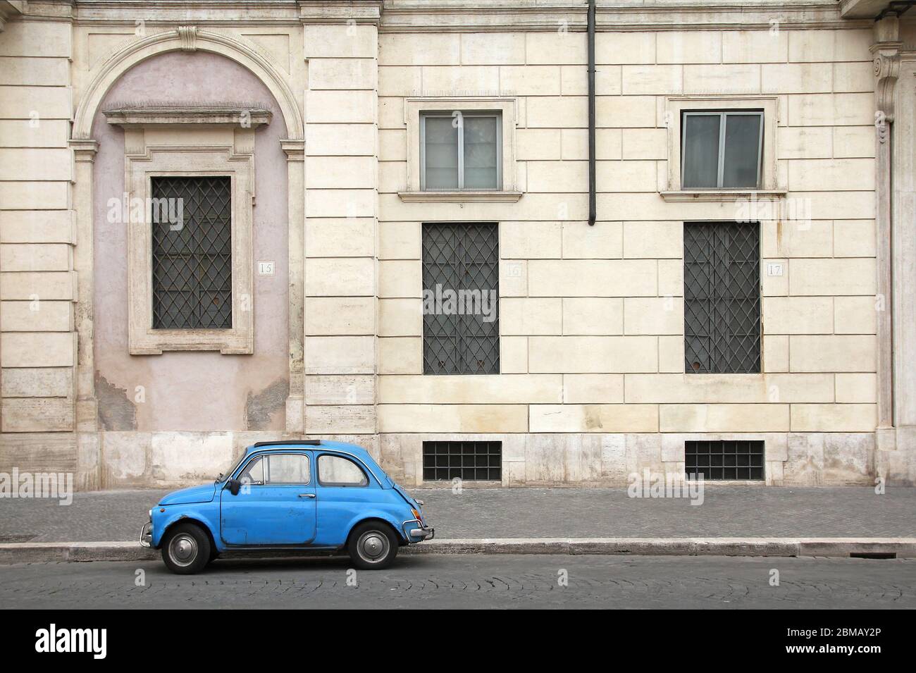 ROME - MAY 12: Fiat 500 parked on May 12, 2010 in Rome, Italy. With almost 4 million units sold, Fiat 500 is among Top 50 cars in automotive history. Stock Photo
