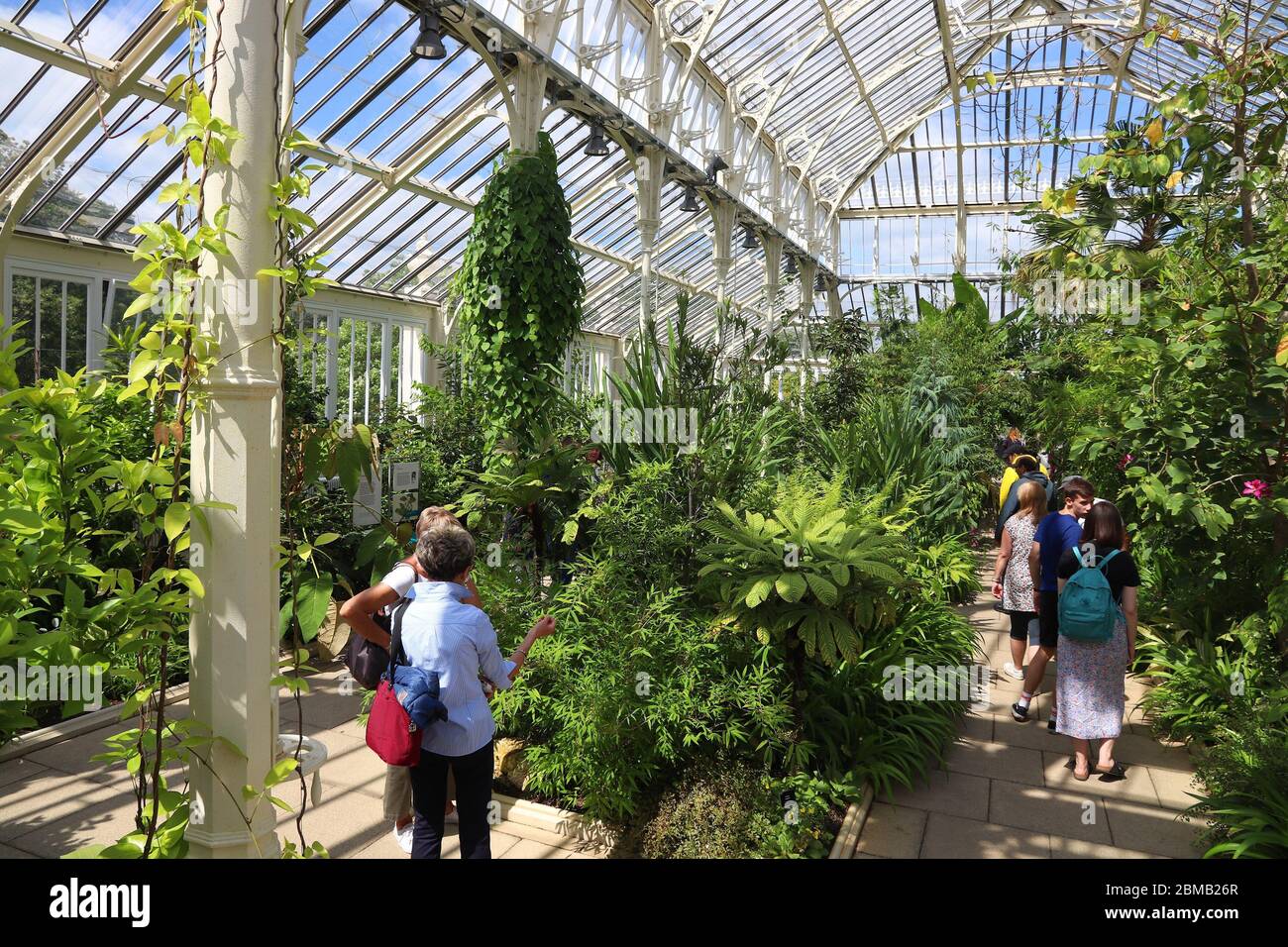 KEW, UK - JULY 15, 2019: People visit Temperate House of Kew Gardens in Greater London. Royal Botanic Gardens are designated as UNESCO World Heritage Stock Photo