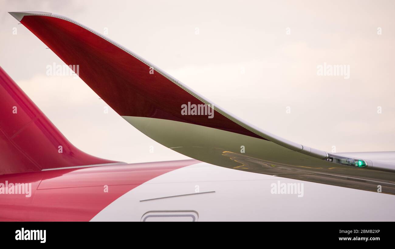 Glasgow, UK. 25 August 2019. Pictured: Virgin Atlantic Airbus A350-1000 aircraft seen at Glasgow International Airport for pilot training. Virgin's brand new jumbo jet boasts an amazing new 'loft' social space with sofas in business class, and aptly adorned by the registration G-VLUX. The entire aircraft will also have access to high-speed Wi-Fi. Virgin Atlantic has ordered a total of 12 Airbus A350-1000s. They are all scheduled to join the fleet by 2021 in an order worth an estimated $4.4 billion (£3.36 billion). Credit: Colin Fisher/Alamy Live News. Stock Photo
