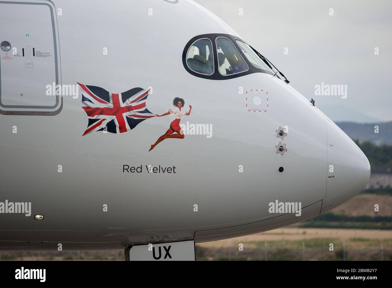 Glasgow, UK. 25 August 2019.  Pictured: Virgin Atlantic Airbus A350-1000 aircraft seen at Glasgow International Airport for pilot training. Virgin's brand new jumbo jet boasts an amazing new 'loft' social space with sofas in business class, and aptly adorned by the registration G-VLUX. The entire aircraft will also have access to high-speed Wi-Fi. Virgin Atlantic has ordered a total of 12 Airbus A350-1000s. They are all scheduled to join the fleet by 2021 in an order worth an estimated $4.4 billion (£3.36 billion). Credit: Colin Fisher/Alamy Live News. Stock Photo