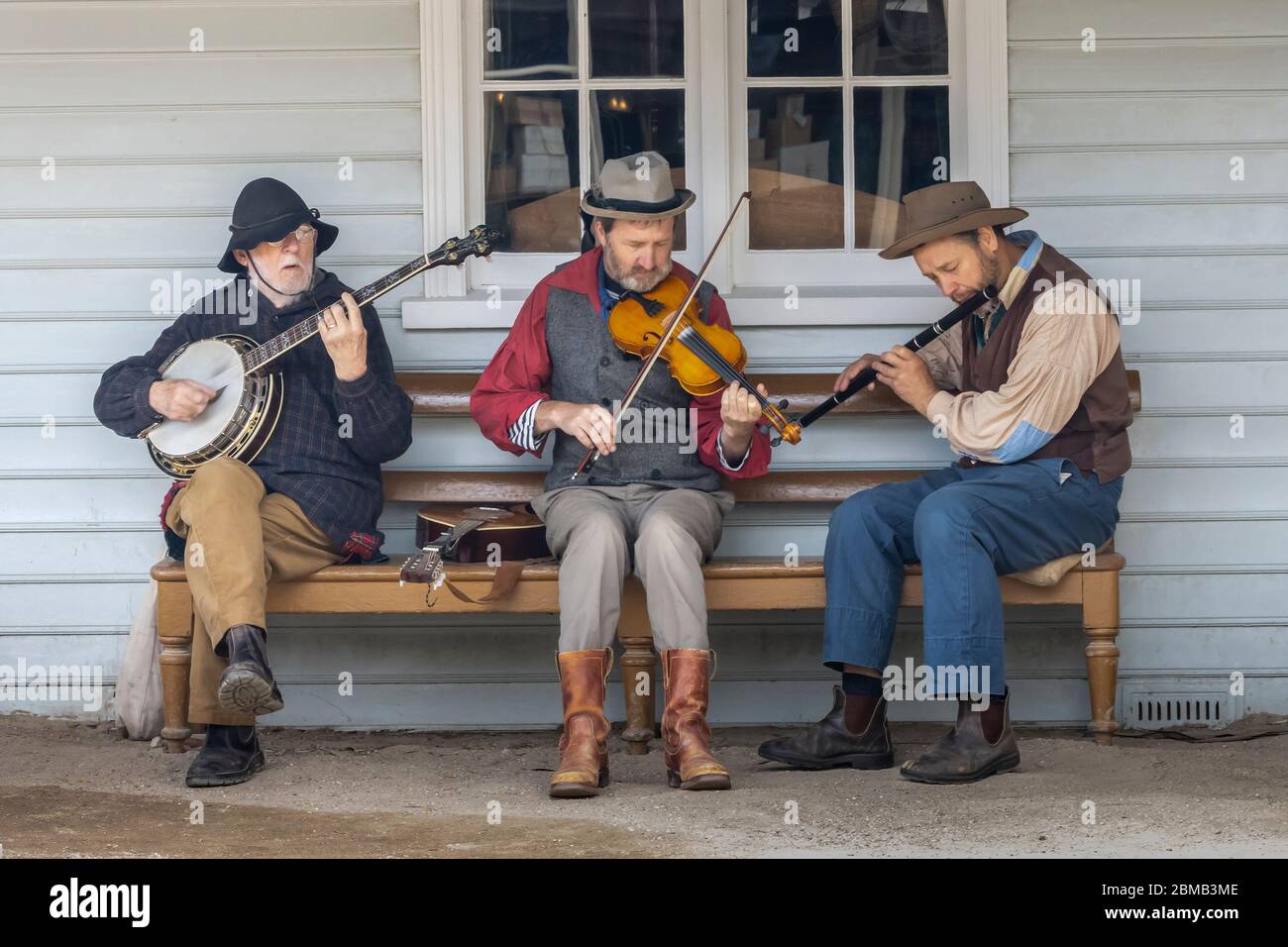 Ballarat, Australia - March 7th, 2020: A trio of street musicians in the recreated gold mining town of Sovereign hill. Stock Photo