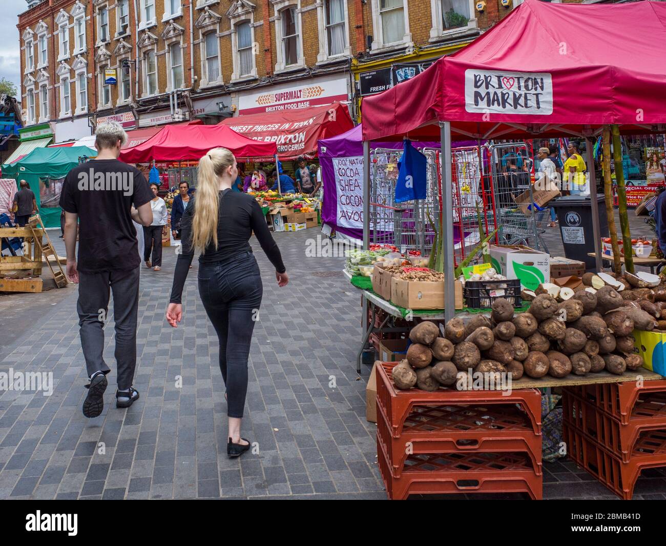 BRIXTON, LONDON-  Busy food and goods market on Brixton's Electric Avenue Stock Photo